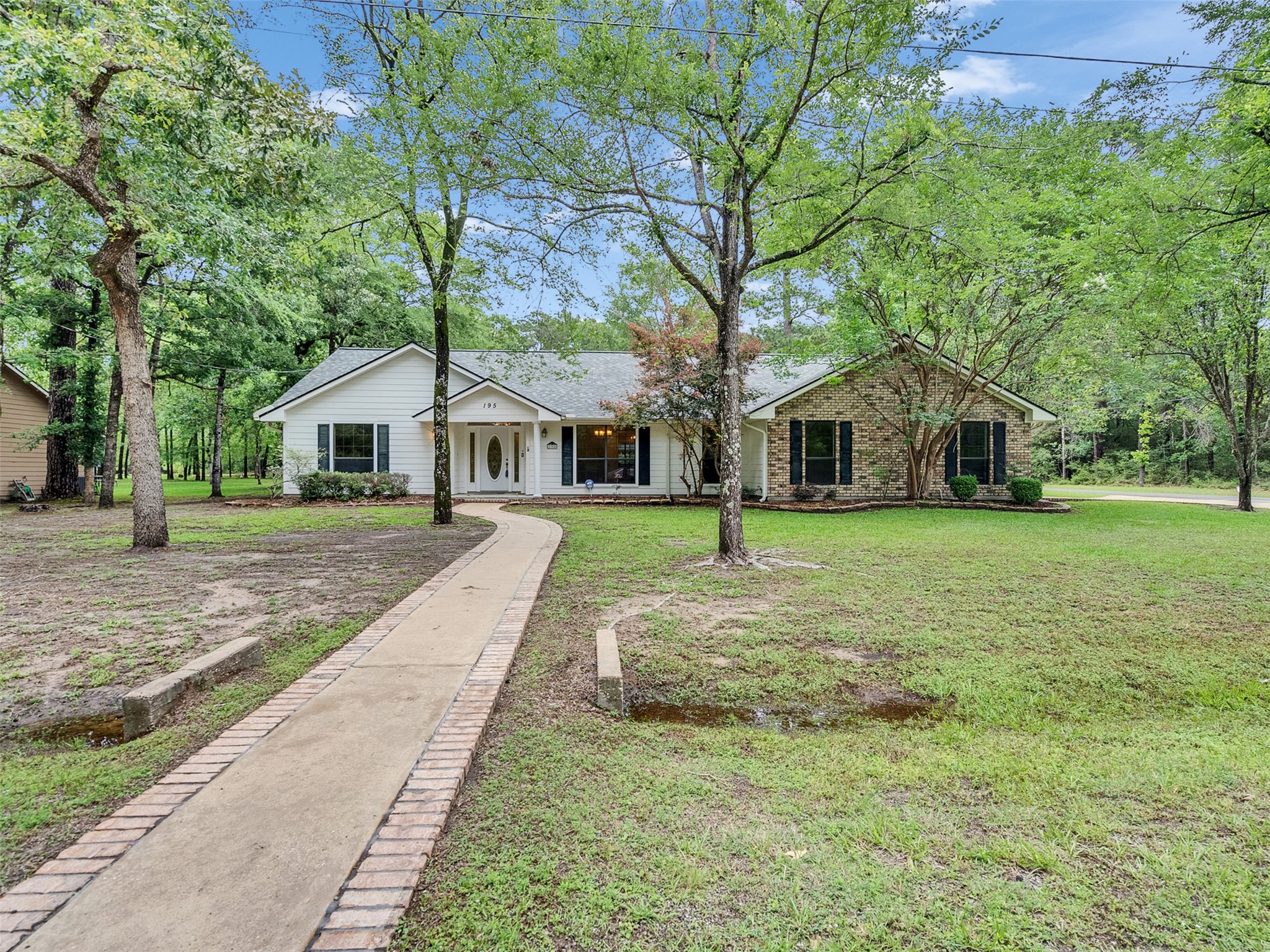 195 Coral Gables Trinity, TX 75862 - Photo 42 of 50 a front view of house with yard and green space