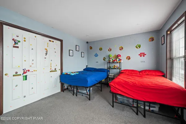 a bedroom with furniture and a table