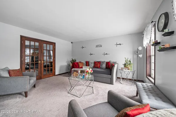 a living room with furniture and a window