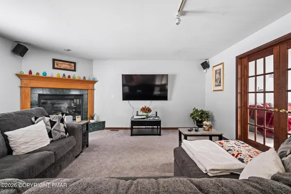 a living room with furniture and a flat screen tv