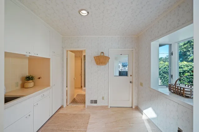 a spacious bathroom with a mirror and a shower