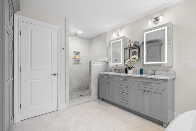 a bathroom with a granite countertop sink a mirror and a