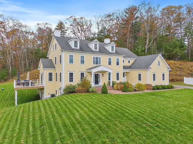 a front view of a house with a yard