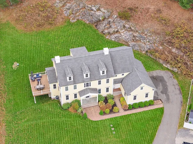 an aerial view of a house with outdoor space patio and entertaining space
