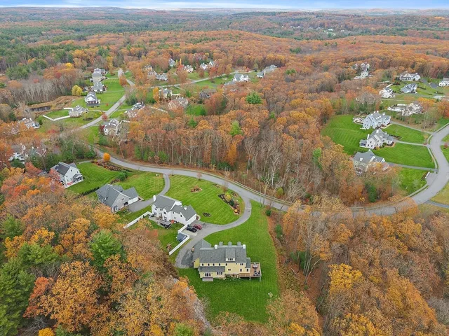 an aerial view of a house with a garden