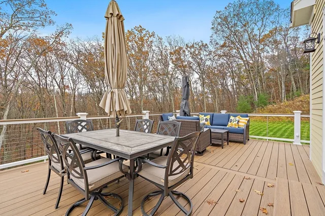 a view of a patio with a table and chairs