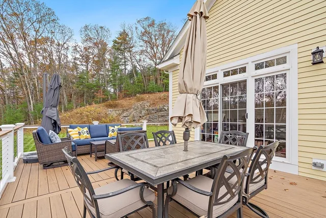 a view of a patio with a table and chairs