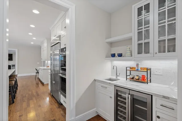 a kitchen with a sink and a refrigerator
