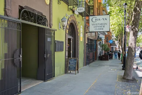 a view of a street with stores