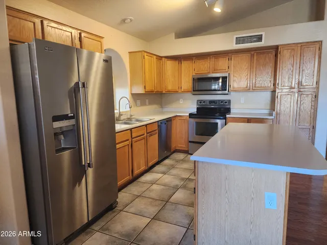 a kitchen with a refrigerator sink and microwave