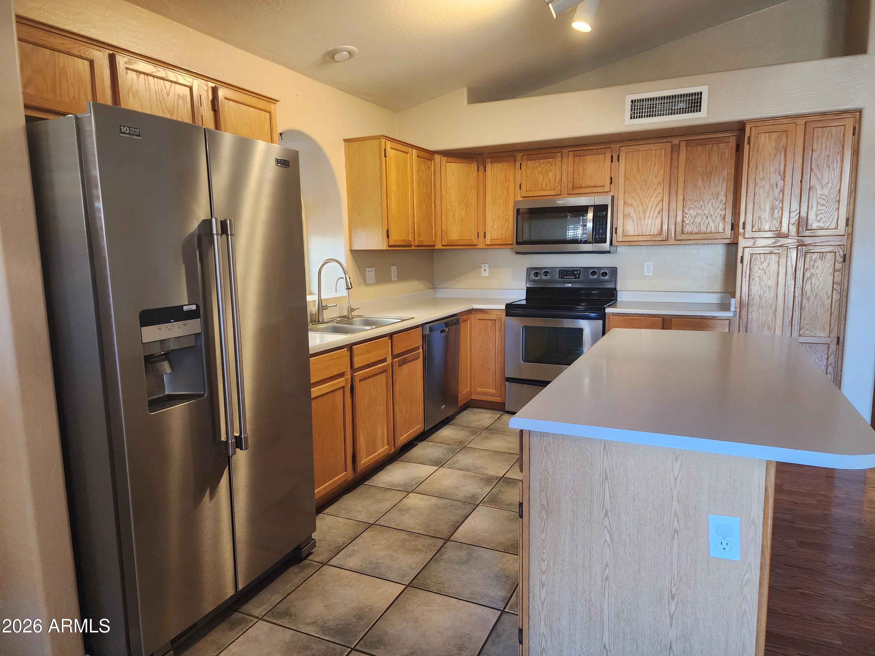 4790 West Tulsa Street Chandler, AZ 85226 - Photo 22 of 30 a kitchen with a refrigerator sink and microwave