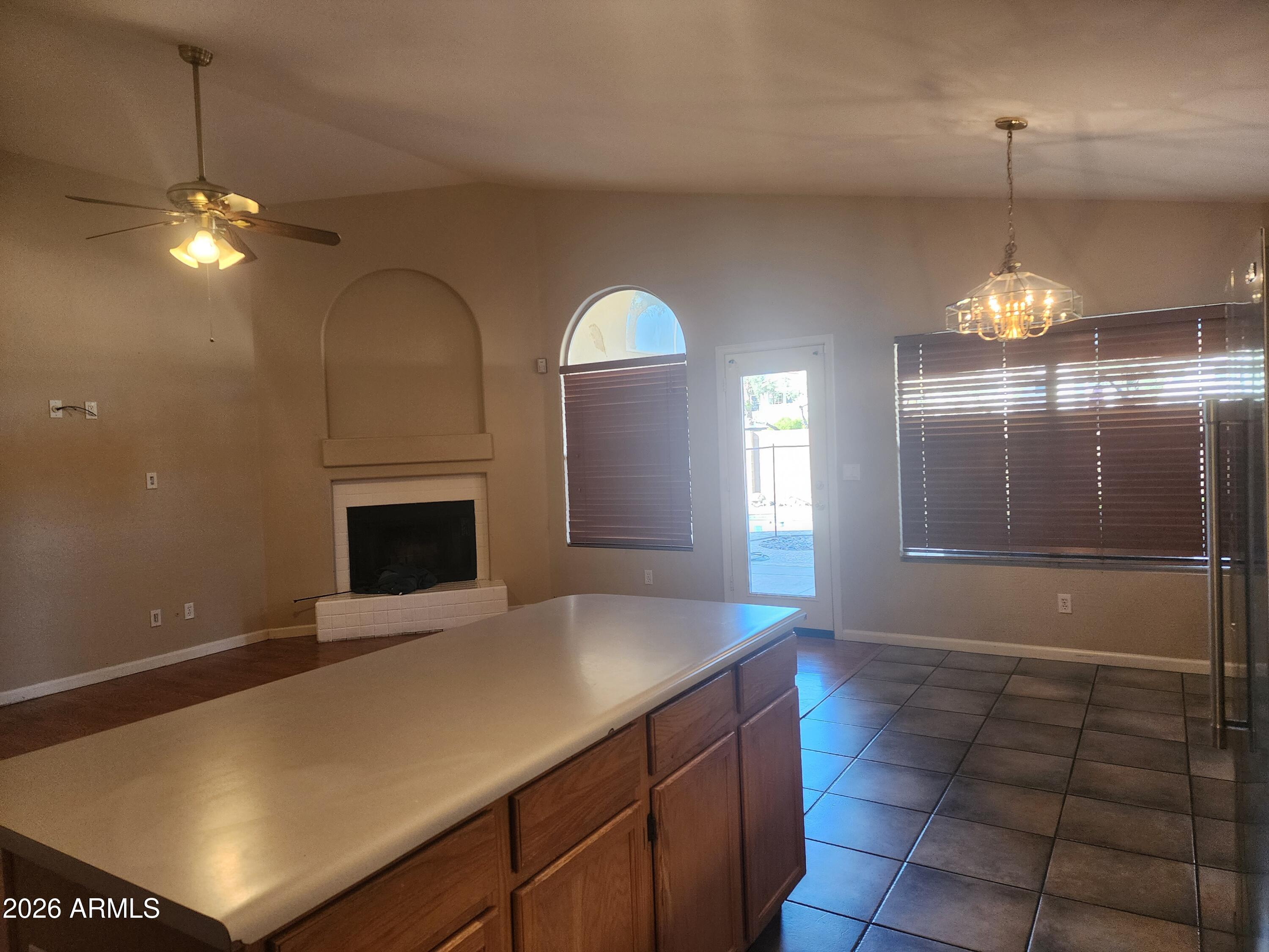 4790 West Tulsa Street Chandler, AZ 85226 - Photo 23 of 30 a view of livingroom and kitchen with fireplace