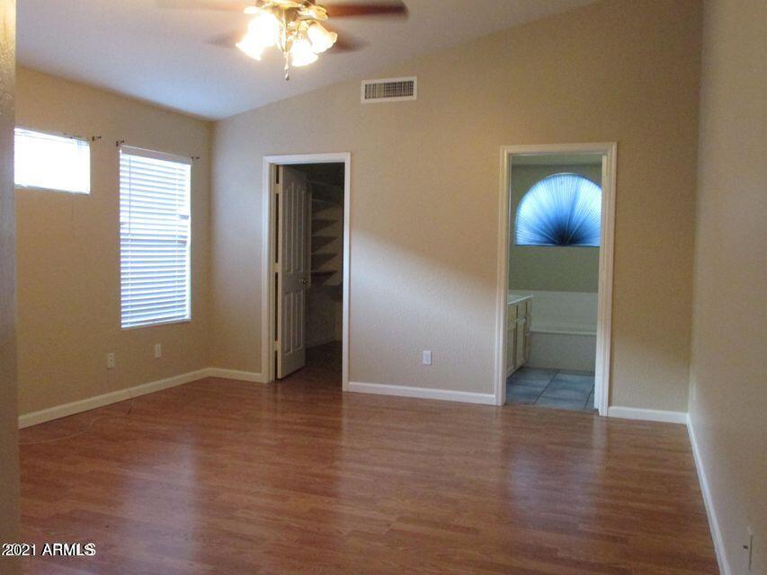4790 West Tulsa Street Chandler, AZ 85226 - Photo 25 of 30 a view of an empty room with window and wooden floor