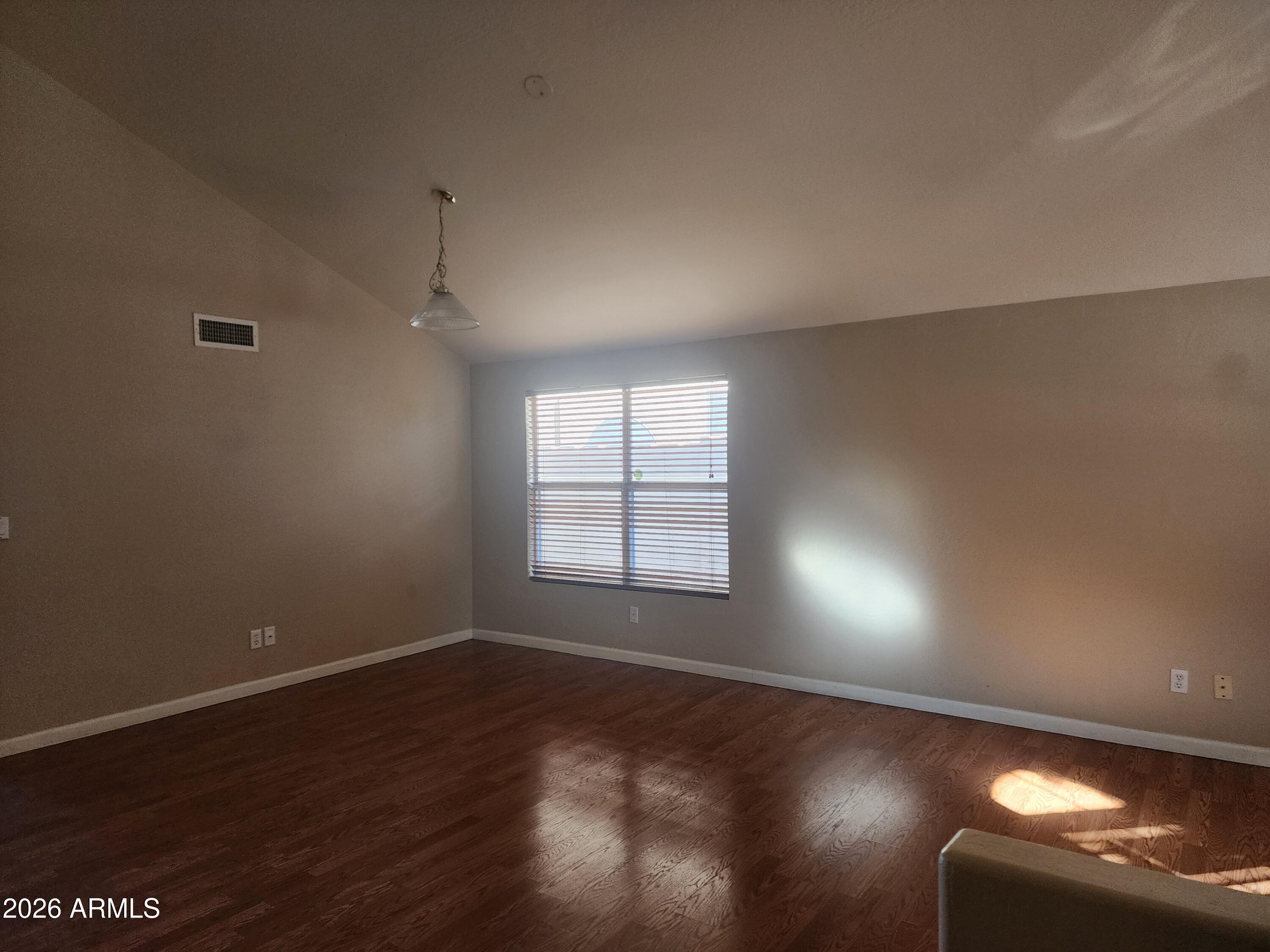 4790 West Tulsa Street Chandler, AZ 85226 - Photo 30 of 30 an empty room with wooden floor and windows