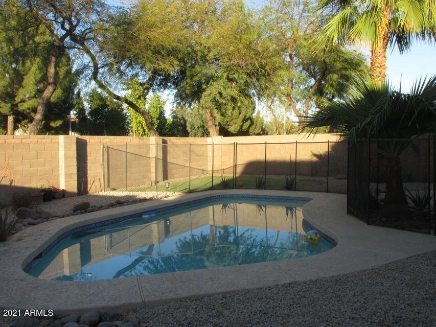 4790 West Tulsa Street Chandler, AZ 85226 - Photo 5 of 30 a view of backyard with swimming pool and outdoor space