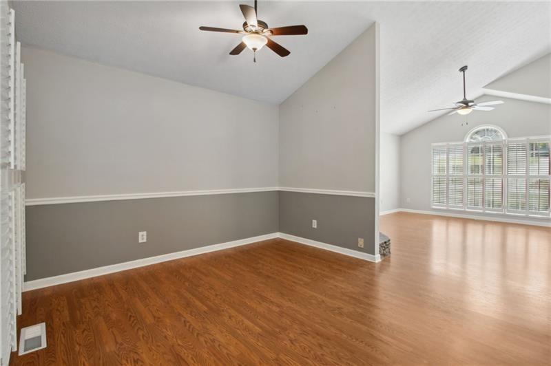 6604 Windbrook Way Flowery Branch, GA 30542 - Photo 18 of 64 an empty room with windows and ceiling fan