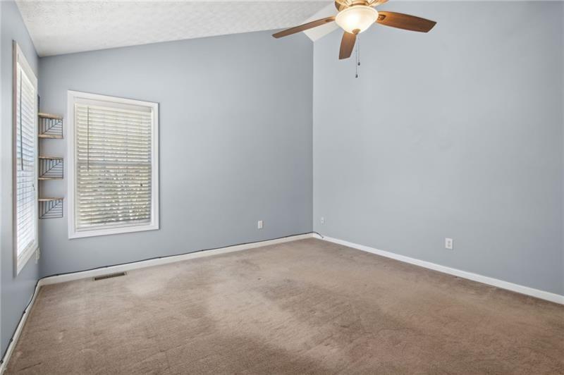 6604 Windbrook Way Flowery Branch, GA 30542 - Photo 29 of 64 a view of an empty room with a window