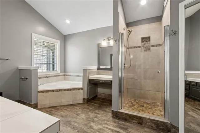 an empty room with a ceiling fan and a window