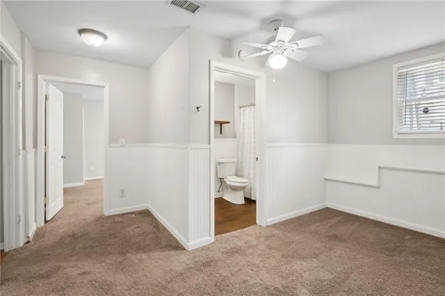 a view of a storage and utility room with cabinets