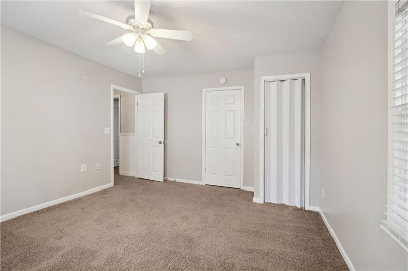 6604 Windbrook Way Flowery Branch, GA 30542 - Photo 49 of 64 a view of an empty room and a ceiling fan