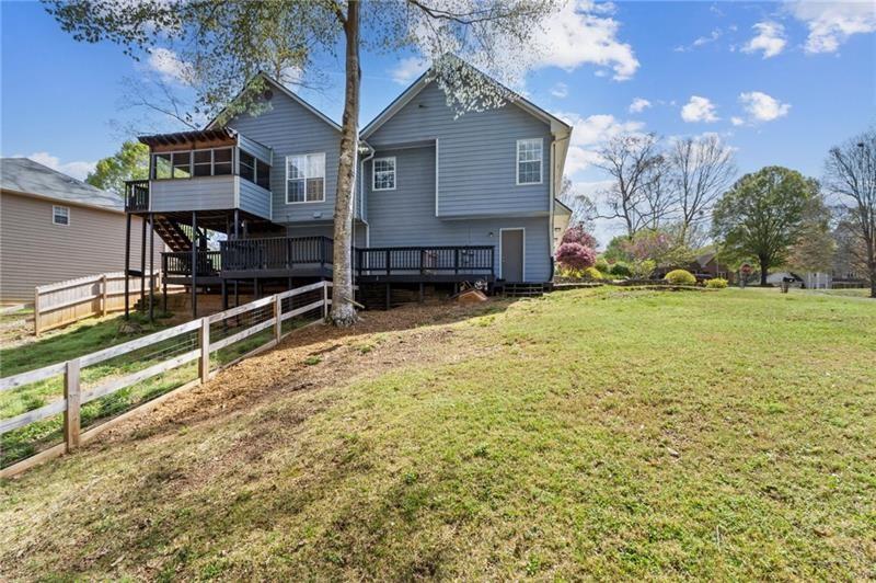 6604 Windbrook Way Flowery Branch, GA 30542 - Photo 56 of 64 a view of a house with a yard