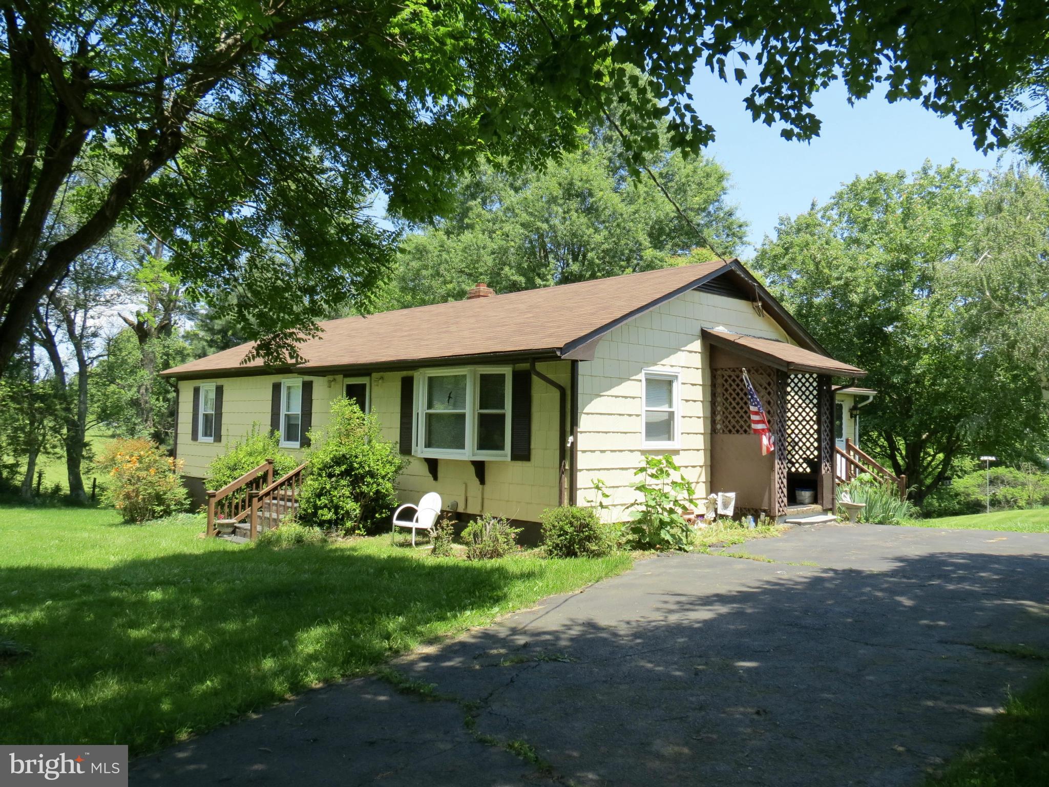 9527 Eggbornsville Road Rixeyville, VA 22737 - Photo 2 of 11 a front view of a house with garden