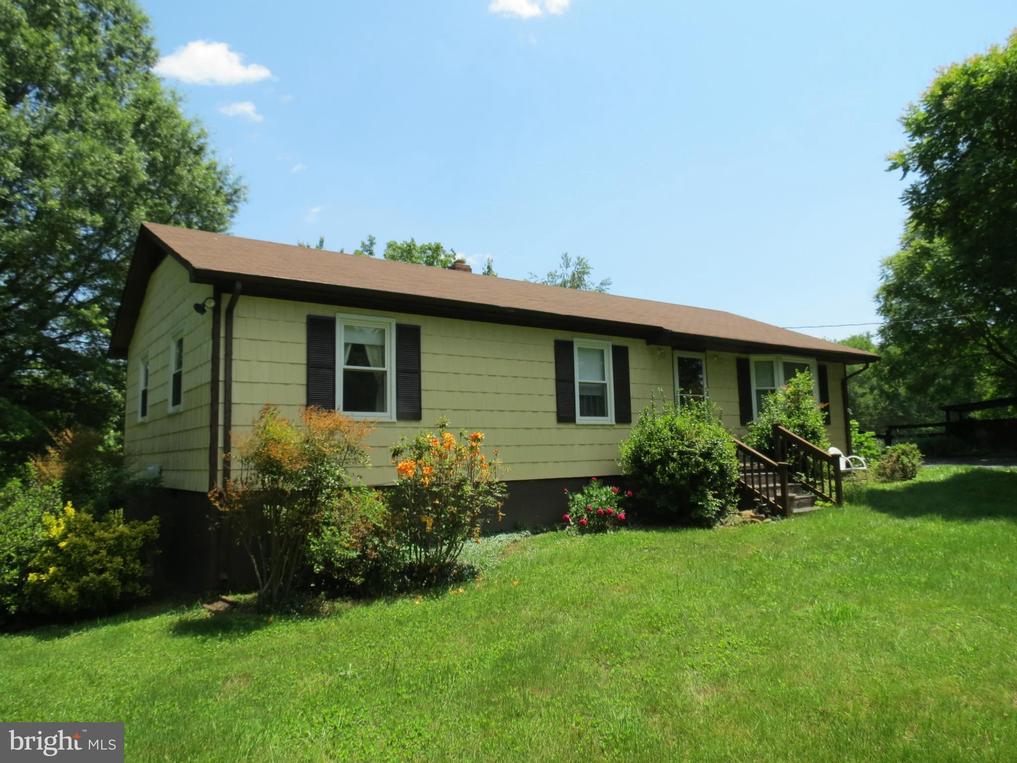 9527 Eggbornsville Road Rixeyville, VA 22737 - Photo 3 of 11 a view of a house with garden and yard