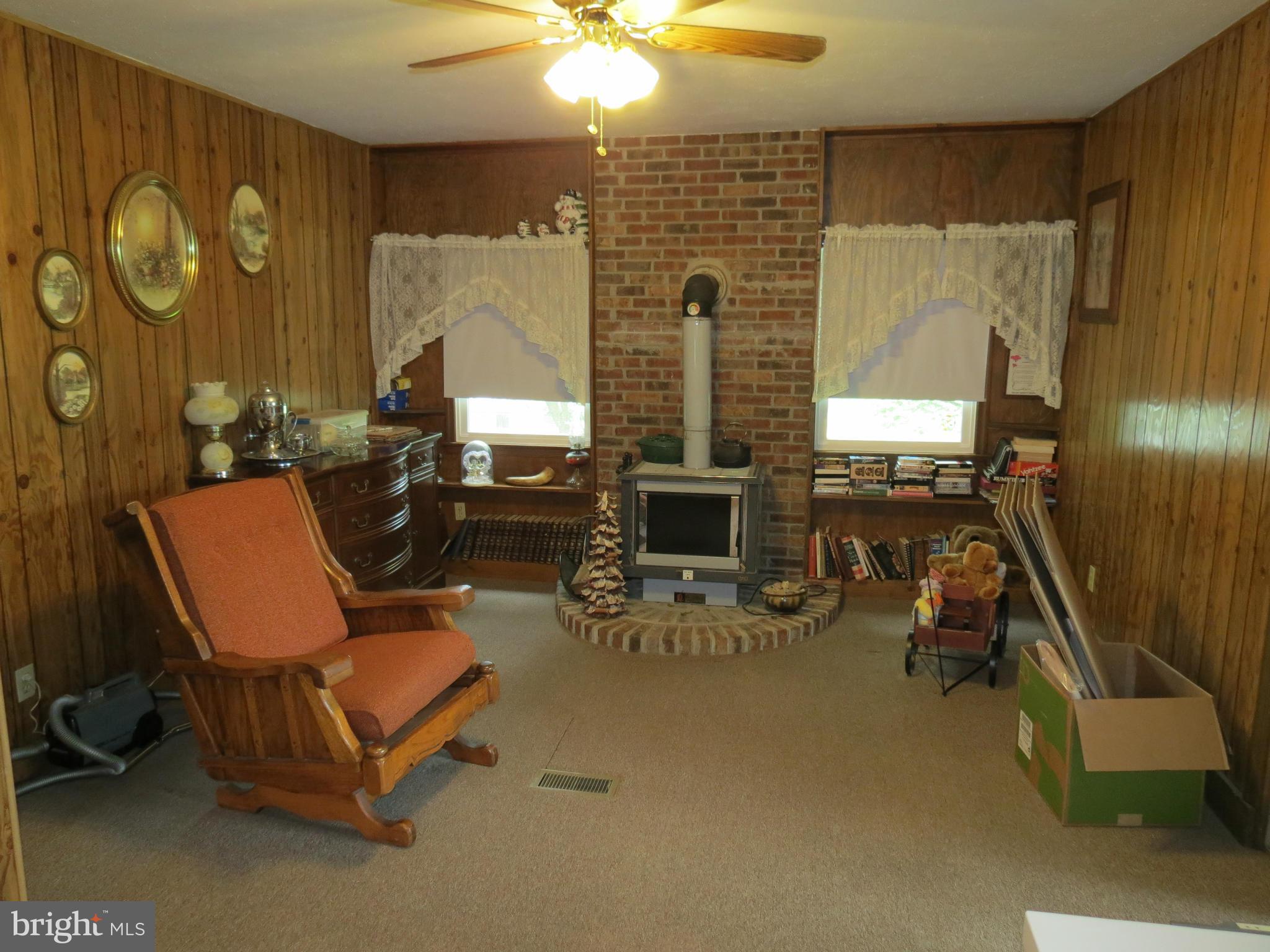 9527 Eggbornsville Road Rixeyville, VA 22737 - Photo 10 of 11 a living room with furniture and a fireplace