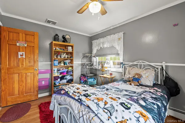 a bedroom with bed and a closet