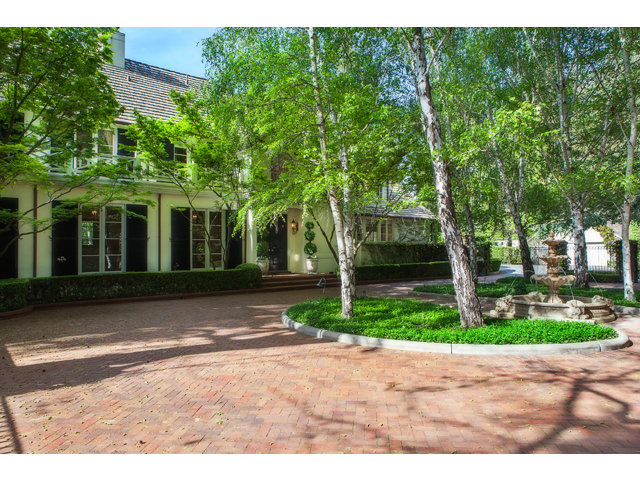 a view of road and trees in the background