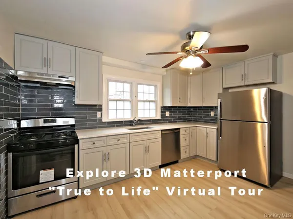 a kitchen with a refrigerator and a stove top oven