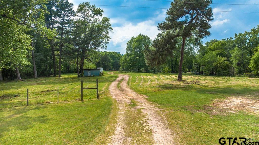 4119 McCann Road Longview, TX 75605 - Photo 14 of 16 a view of a swimming pool with a yard