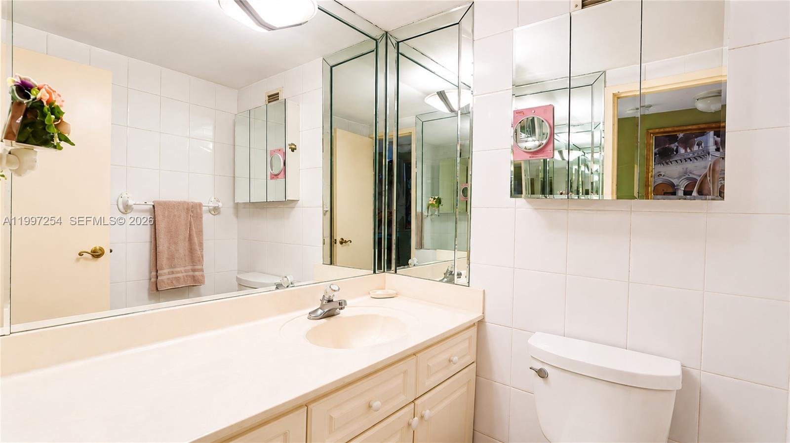 100 Lincoln Road, Unit 422 Miami Beach, FL 33139 - Photo 11 of 23 a bathroom with a sink and a mirror