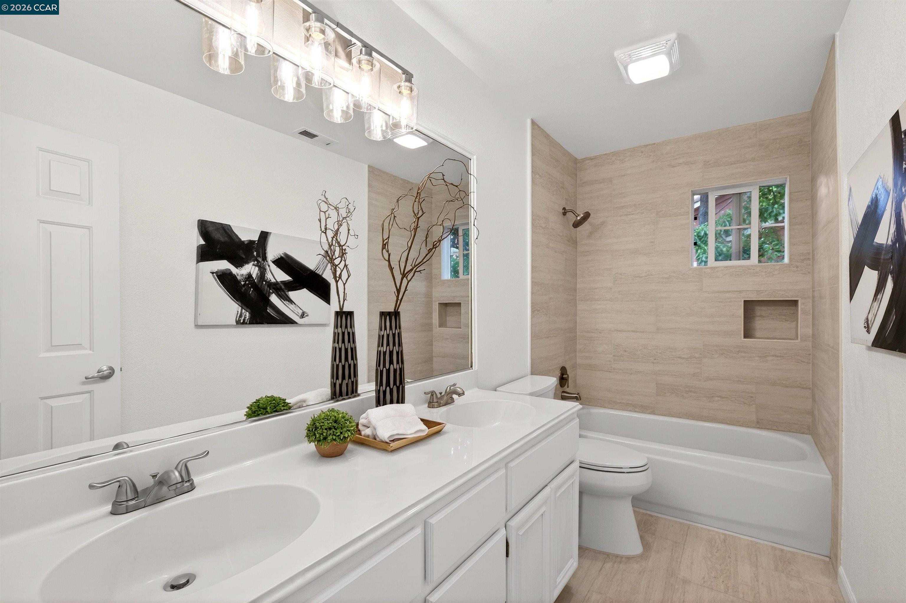 124 Coralflower Lane San Ramon, CA 94582 - Photo 22 of 47 a bathroom with a granite countertop sink a toilet and shower