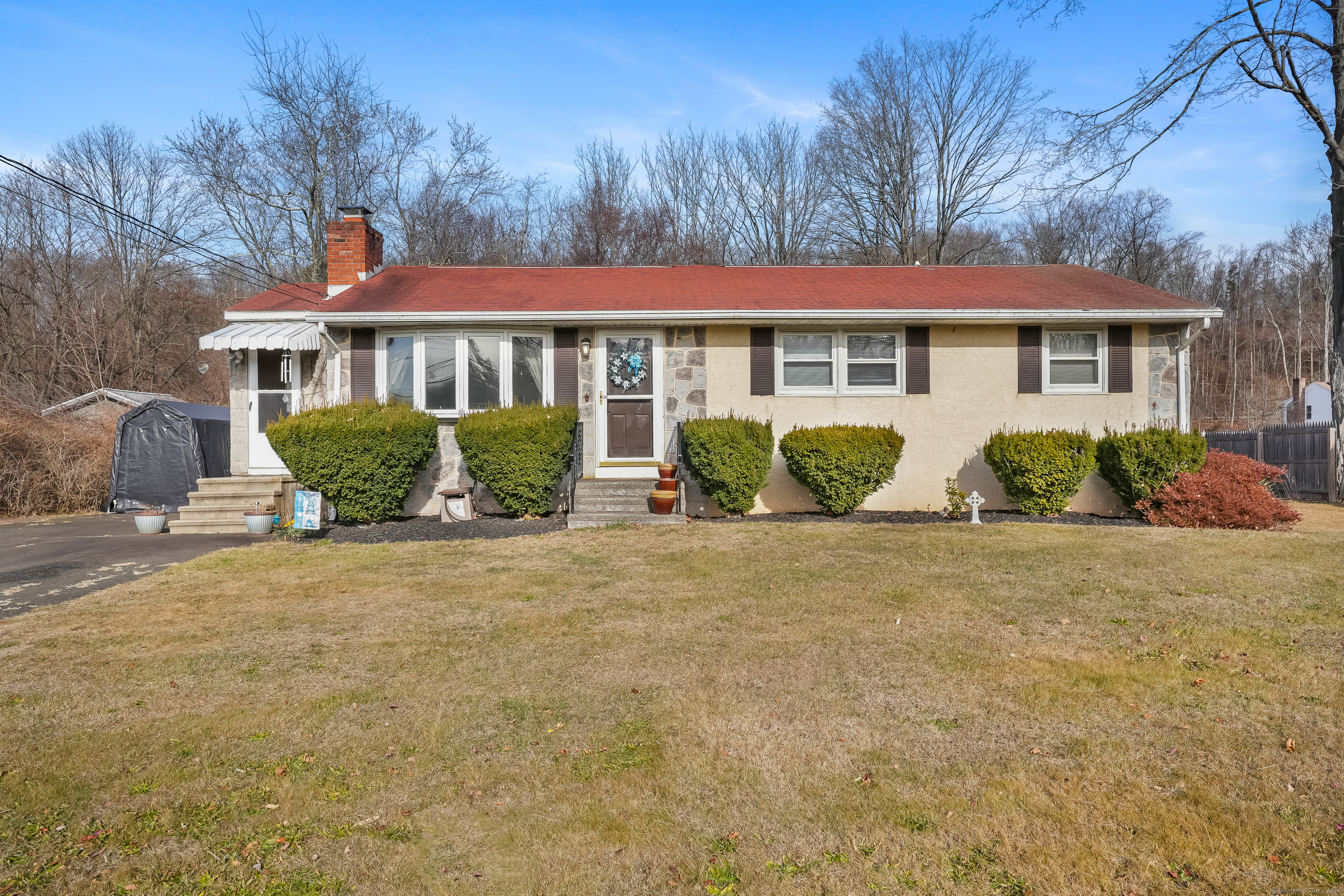 a front view of a house with garden