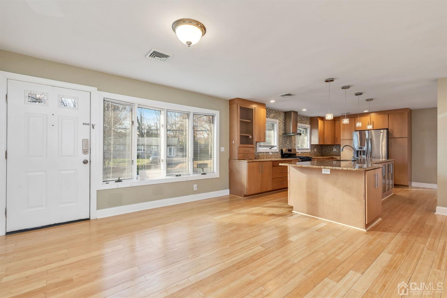 46 Harvard Road Old Bridge, NJ 08859 - Photo 3 of 43 a large white kitchen with granite countertop a sink and a large window