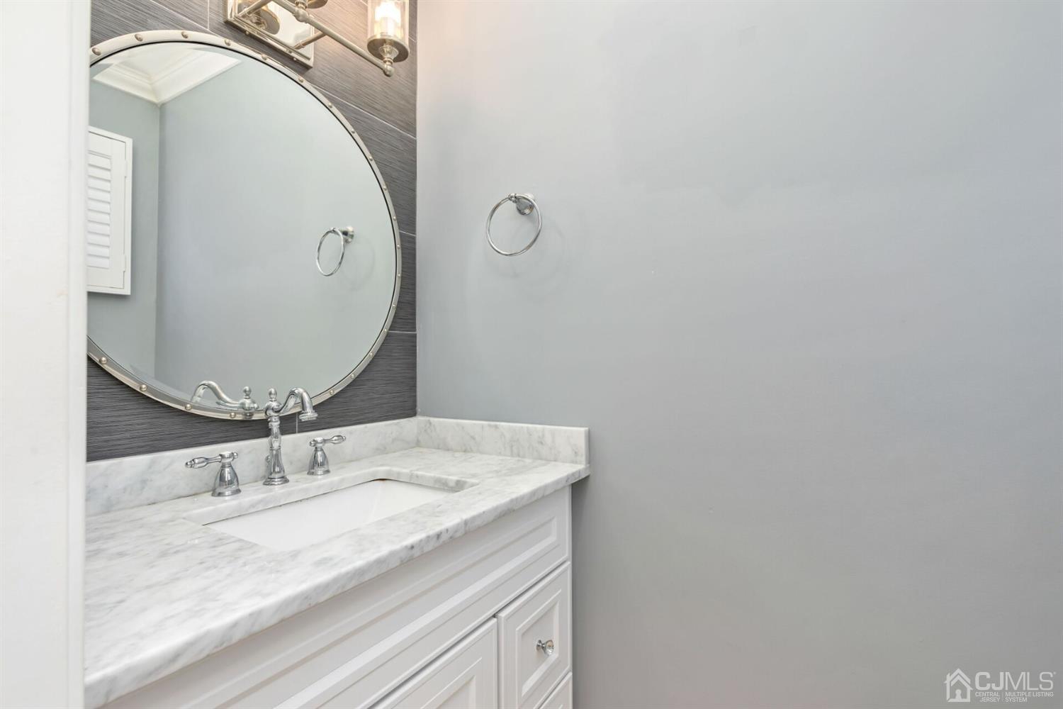 46 Harvard Road Old Bridge, NJ 08859 - Photo 22 of 43 a bathroom with a granite countertop sink a mirror and vanity