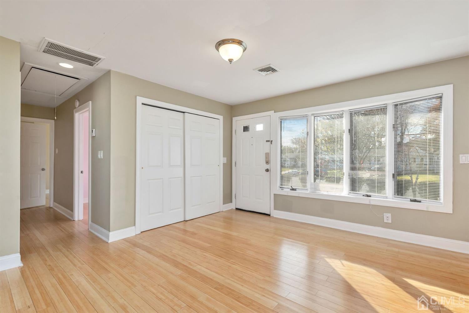 46 Harvard Road Old Bridge, NJ 08859 - Photo 4 of 43 a view of empty room with wooden floor and fan
