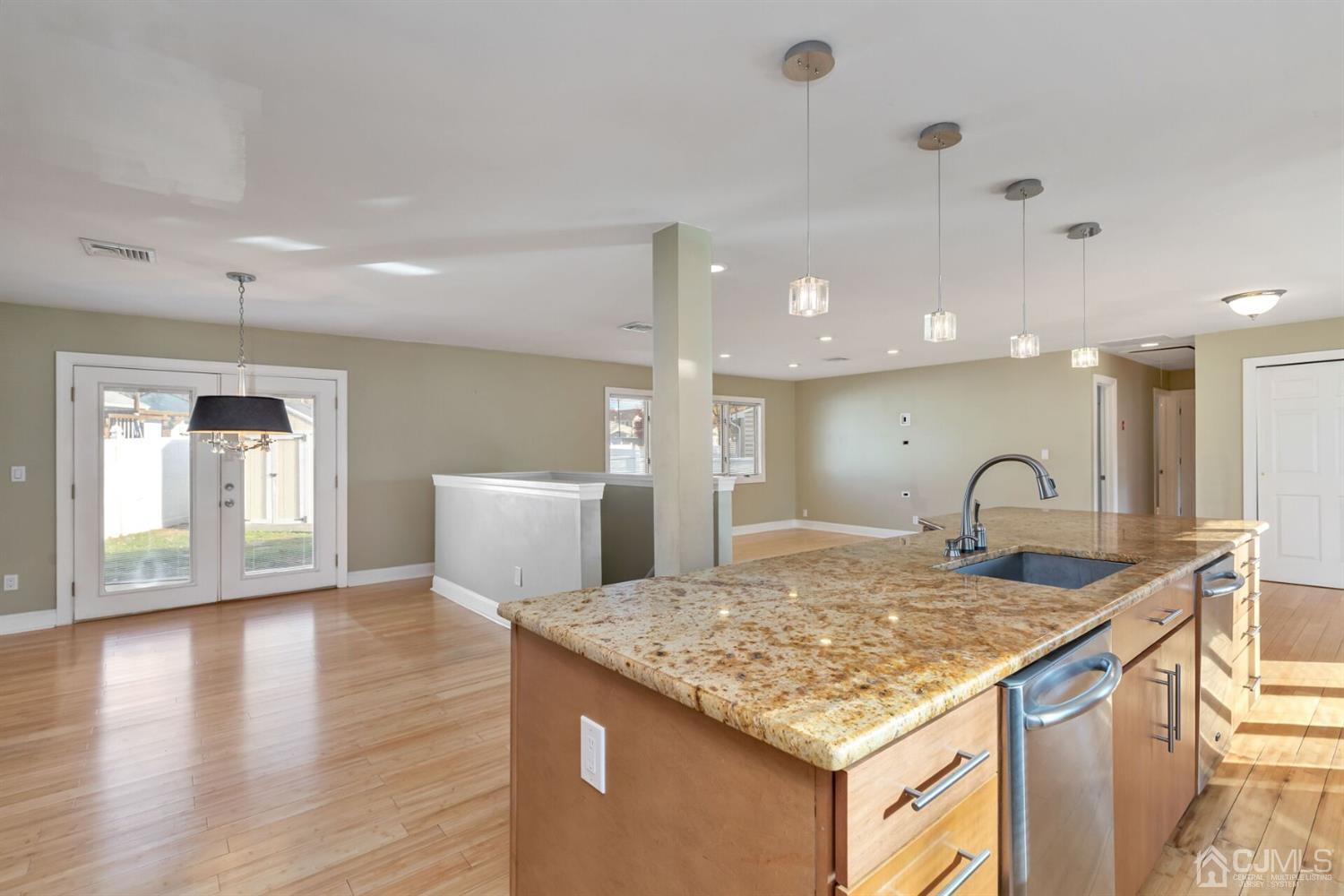 46 Harvard Road Old Bridge, NJ 08859 - Photo 8 of 43 a kitchen with kitchen island a sink appliances and wooden floor