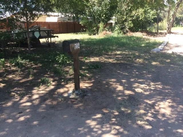 a backyard of a house with a yard