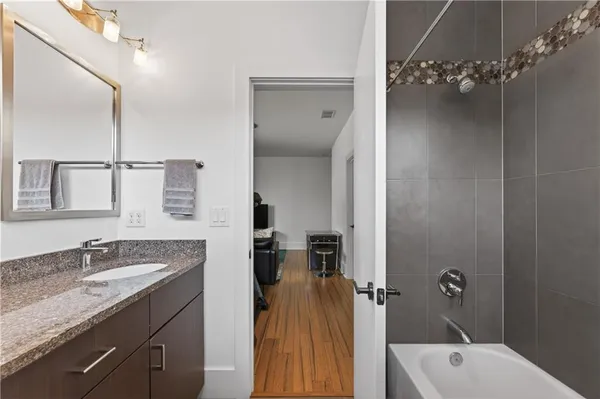 a bathroom with a double vanity sink and a mirror