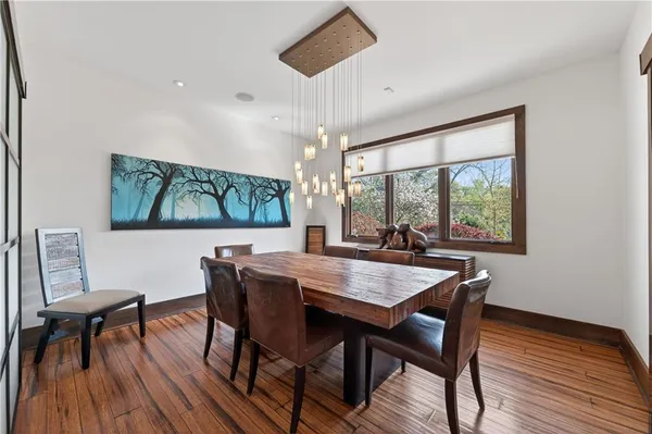 a view of a dining room with furniture window and wooden floor