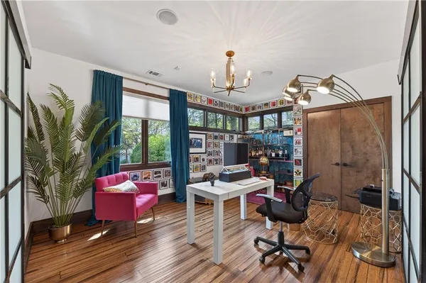 a view of a livingroom with furniture and a workspace