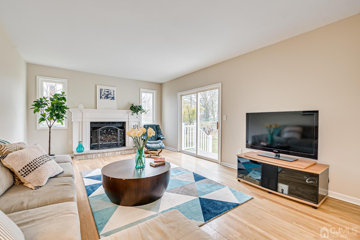 9 Ramsey Road Edison, NJ 08820 - Photo 11 of 37 a living room with furniture and a flat screen tv