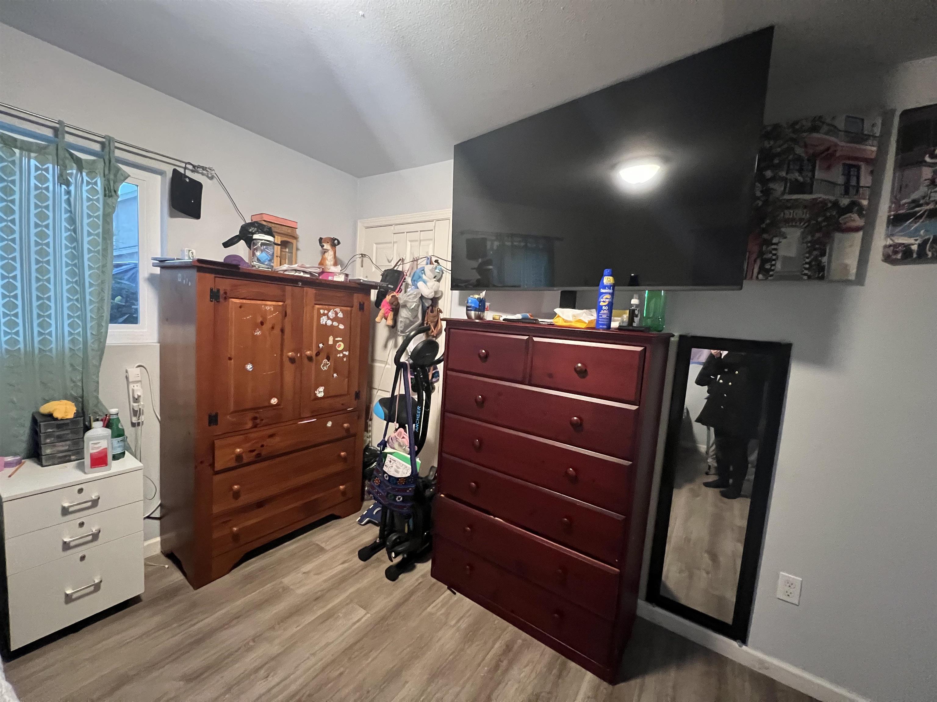1803 Rosedale Avenue Oakland, CA 94601 - Photo 23 of 28 Bedroom featuring light wood-type flooring and a closet