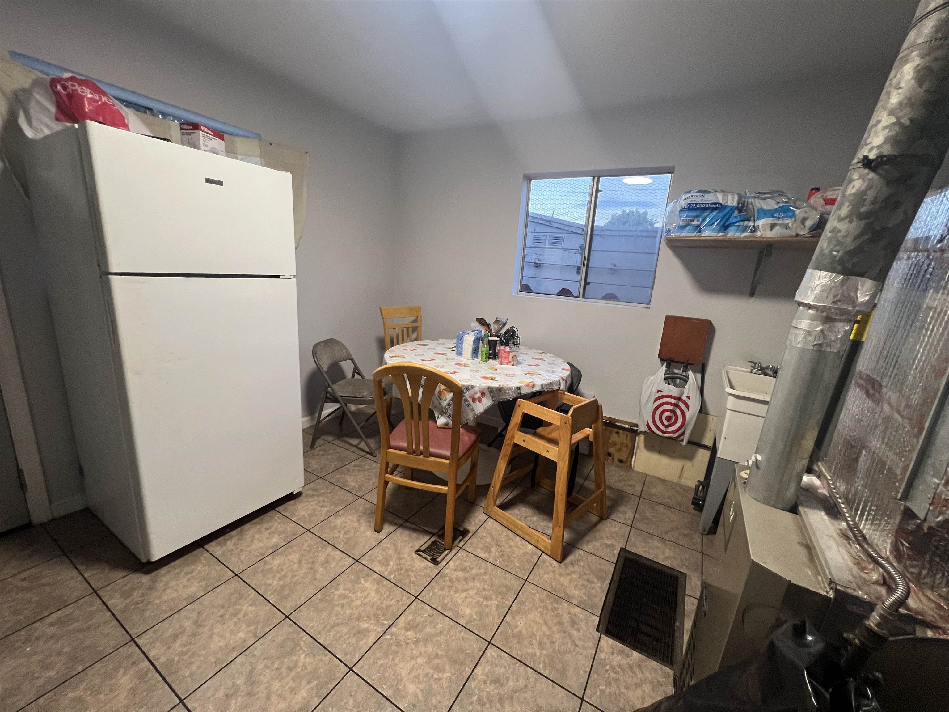 1803 Rosedale Avenue Oakland, CA 94601 - Photo 24 of 28 Dining space with light tile patterned flooring