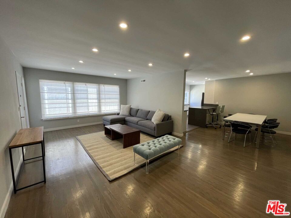 348 South Elm Drive, Unit 6 Beverly Hills, CA 90212 - Photo 4 of 17 a living room with furniture and a table