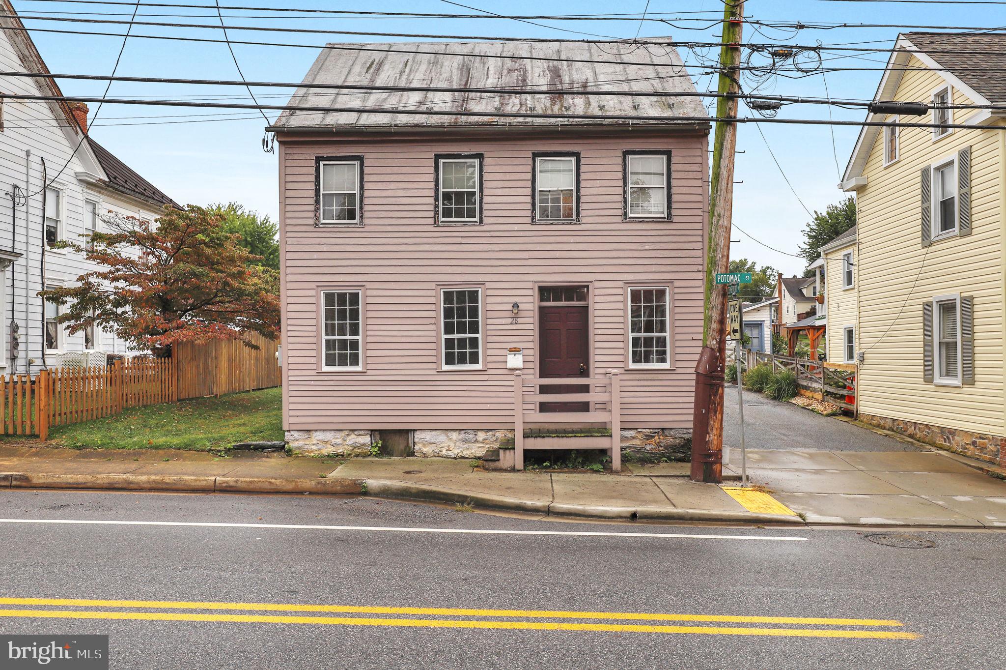 a view of a house with a street