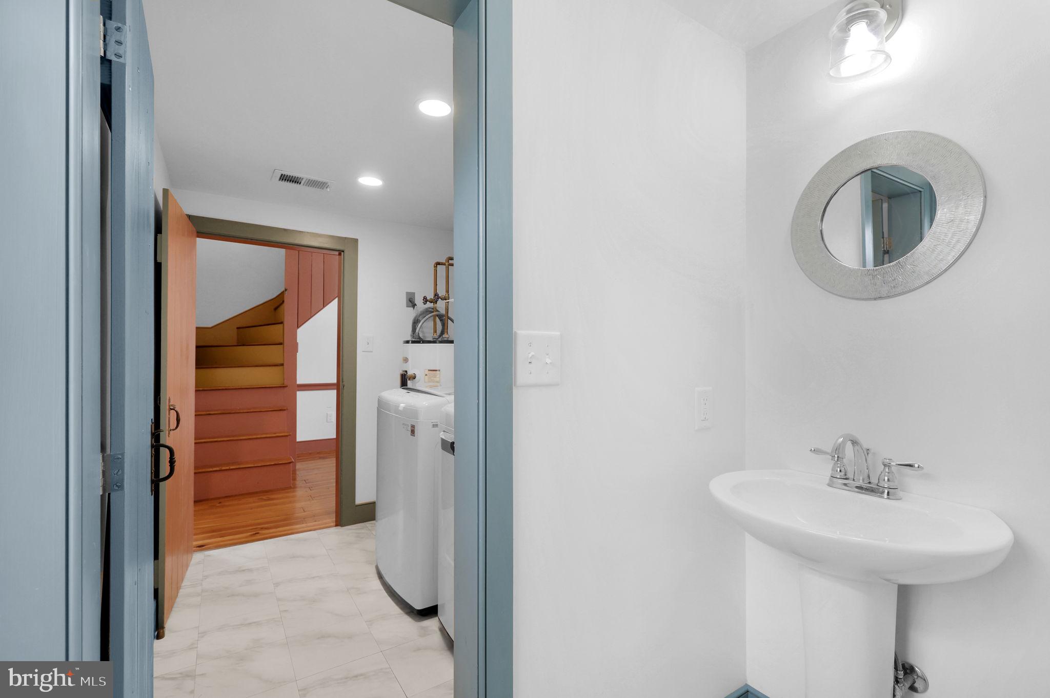 28 Potomac Street Boonsboro, MD 21713 - Photo 11 of 52 a bathroom with a sink and a mirror