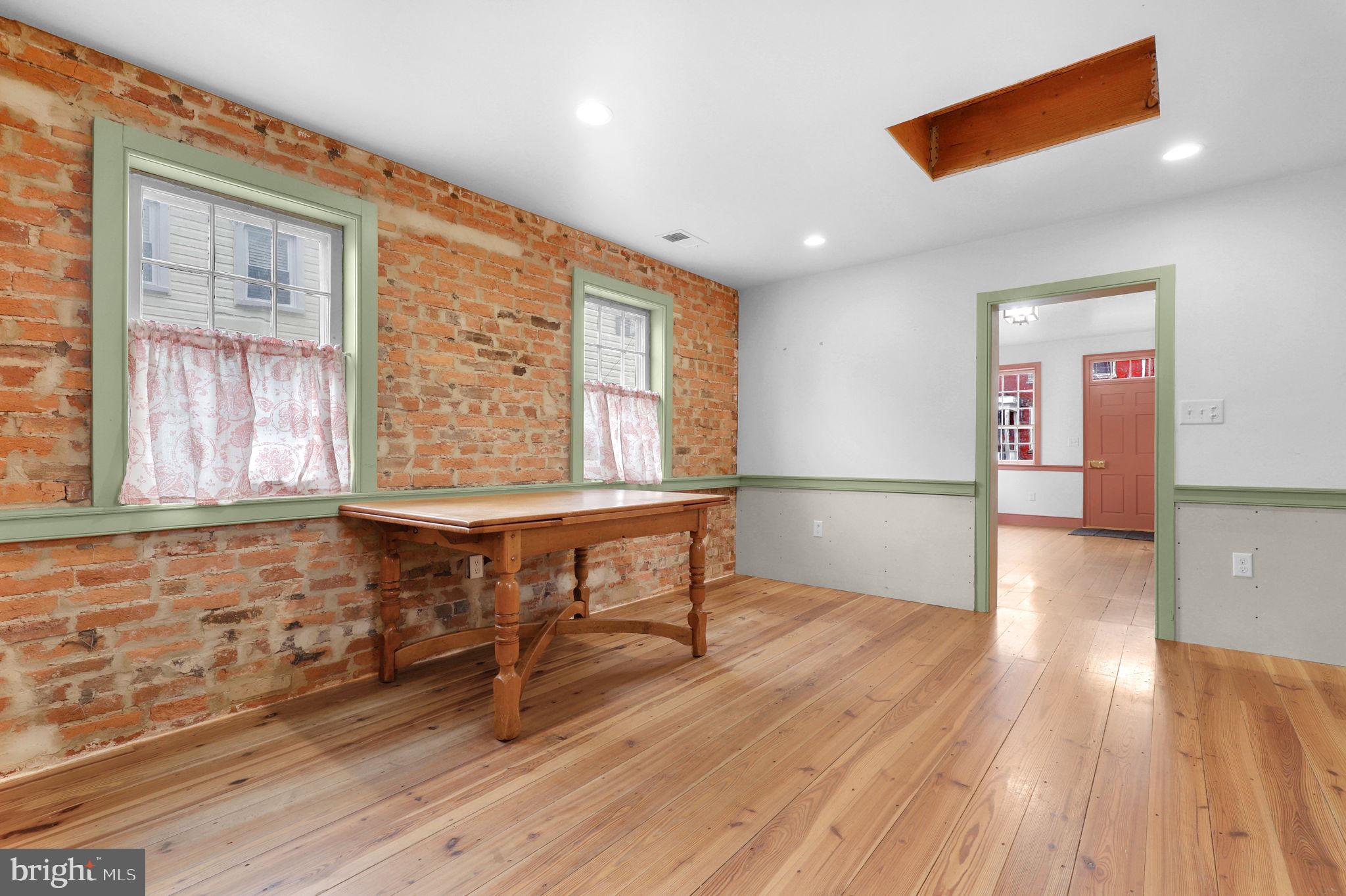 28 Potomac Street Boonsboro, MD 21713 - Photo 15 of 52 a view of an empty room with wooden floor and a window